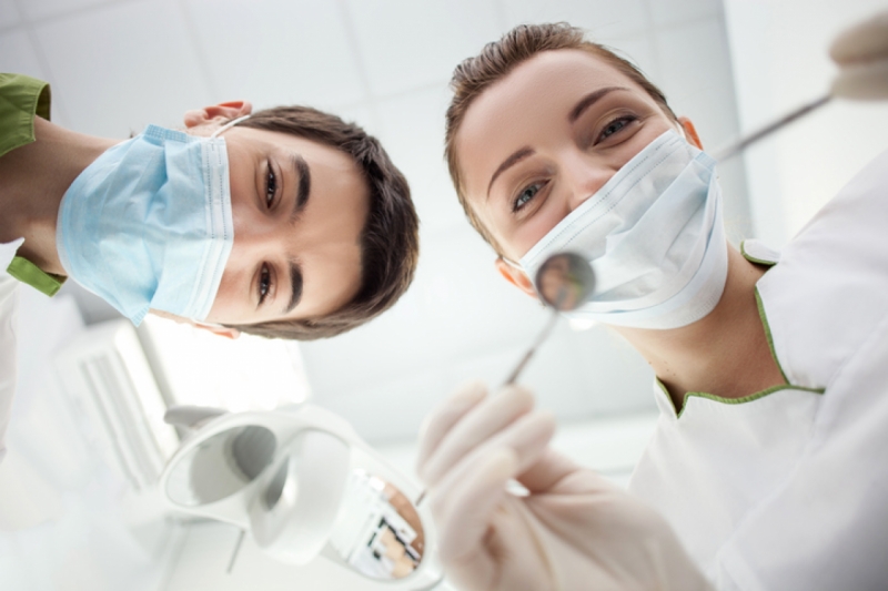 Dentist doing dental treatment